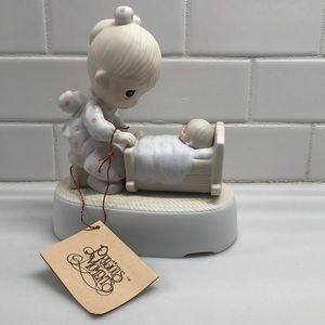 Precious Moments  The Hand That Rocks The Future.